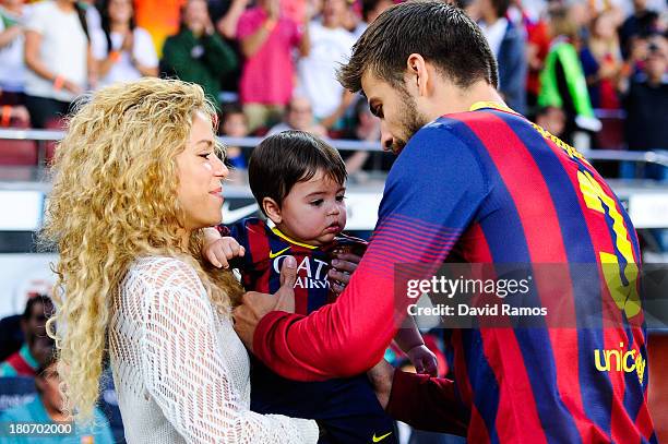 Shakira and Gerard Pique of FC Barcelona are seen with their son Milan prior to the La Liga match between FC Barcelona and Sevilla FC at Camp Nou on...