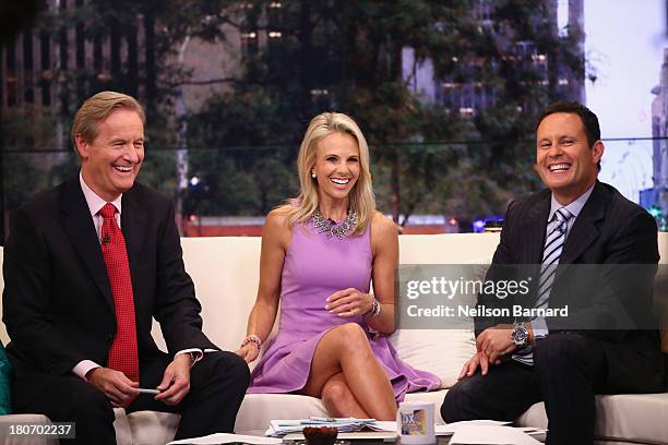 Elisabeth Hasselbeck Joins "FOX & Friends" hosts Steve Doocy and Brian Kilmeade at FOX Studios on September 16, 2013 in New York City.