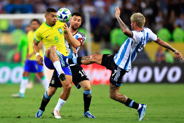 Lionel Messi of Argentina and André of Brazil battle for the ball during a FIFA World Cup 2026 Qualifier match between Brazil and Argentina at...