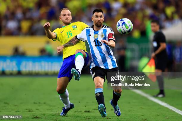 Lionel Messi of Argentina and Carlos Augusto of Brazil battle for the ball during a FIFA World Cup 2026 Qualifier match between Brazil and Argentina...