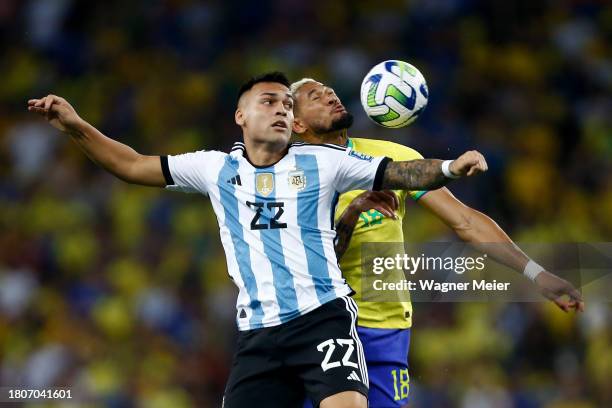 Lautaro Martinez of Argentina jumps for the ball against Joelinton of Brazil during a FIFA World Cup 2026 Qualifier match between Brazil and...