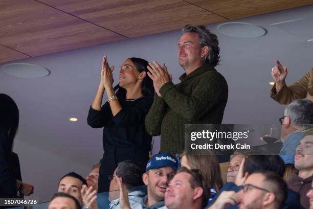 Meghan Markle, The Duchess of Sussex cheers during the NHL game between the Vancouver Canucks and San Jose Sharks at Rogers Arena on November 20,...