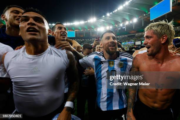 Lionel Messi of Argentina and teammates celebrate with fans after winning a FIFA World Cup 2026 Qualifier match between Brazil and Argentina at...