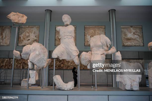 Visitors walk through the Acropolis Museum, in Athens on November 28, 2023. Greek Prime Minister Kyriakos Mitsotakis accuses the Prime Minister of...