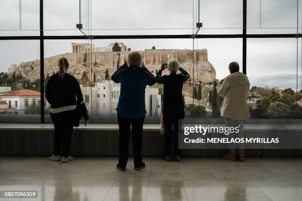 Visitors walk through the Acropolis Museum, in Athens on November 28, 2023. Greek Prime Minister Kyriakos Mitsotakis accuses the Prime Minister of...