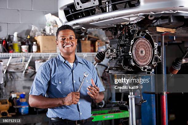 auto mechanic fixing car transmission - car transmission stock pictures, royalty-free photos & images