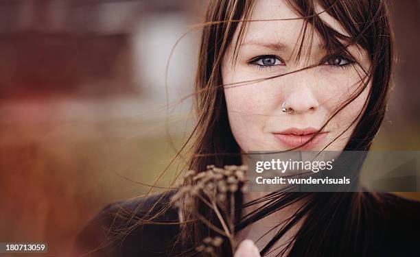 emo girl is holding a dead plant - emo girl stock pictures, royalty-free photos & images