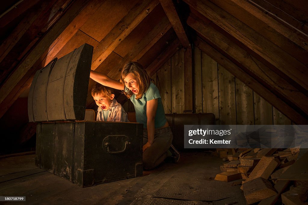 Kids finding a treasure chest at the attic