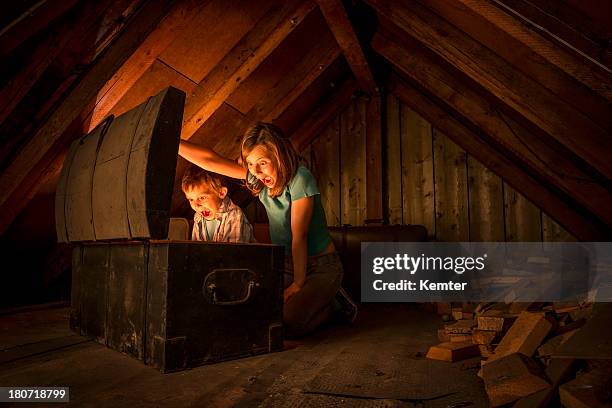 kids finding a treasure chest at the attic - treasure stock pictures, royalty-free photos & images