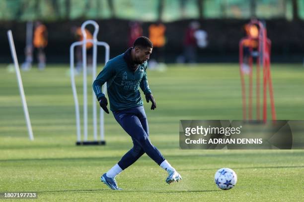 Arsenal's English midfielder Reiss Nelson attends a team training session at Arsenal's training ground in north London, on November 28 on the eve of...