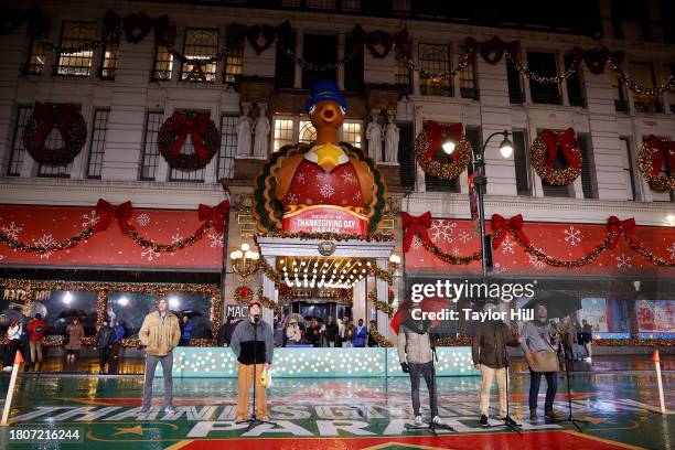 Drew Holcomb and the Neighbors rehearses for the 2023 Macy's Thanksgiving Day Parade at Macy's Herald Square on November 21, 2023 in New York City.