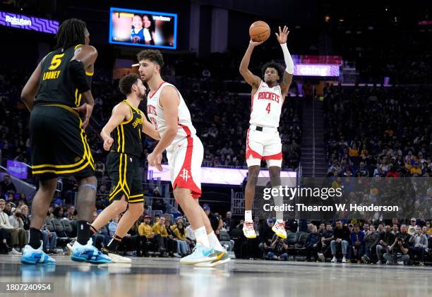 Jalen Green of the Houston Rockets shoots a three-point shot against the Golden State Warriors during the first quarter of an NBA basketball game at...