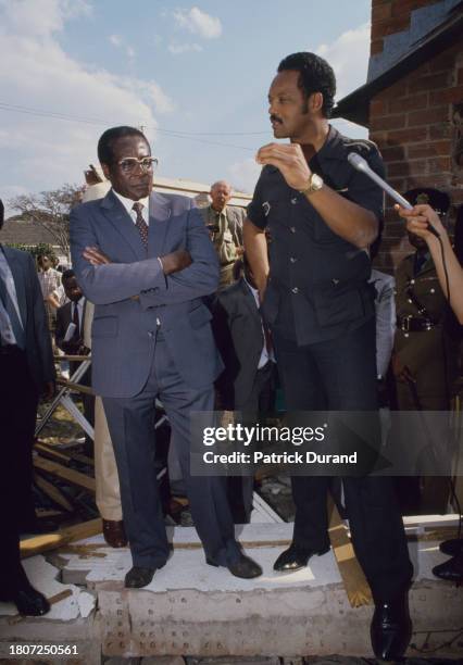 Zimbabwean prime minister Robert Mugabe with American civil rights activist Jesse Jackson during the eighth Summit of Non-Aligned Countries, hosted...