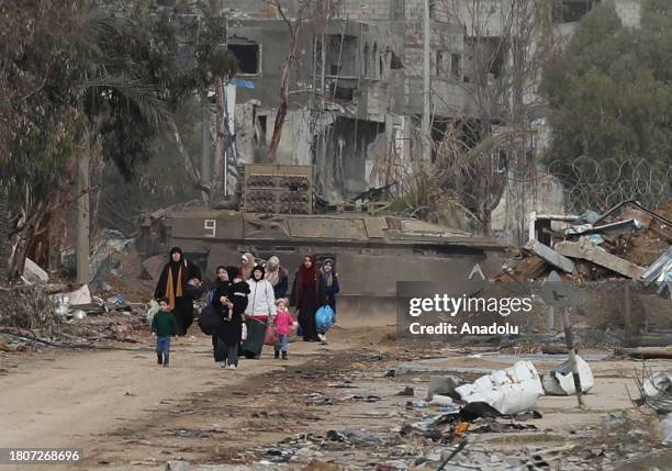 Gazans displaced due to Israeli attacks move towards the southern Gaza Strip through roads determined by the Israeli army as 'safe passage corridor'...