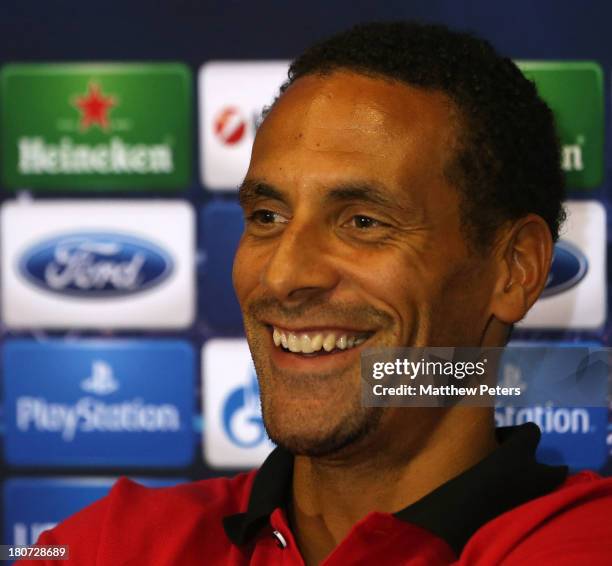 Rio Ferdinand of Manchester United speaks during a press conference, ahead of their UEFA Champions League match against Bayer Leverkusen, at Old...