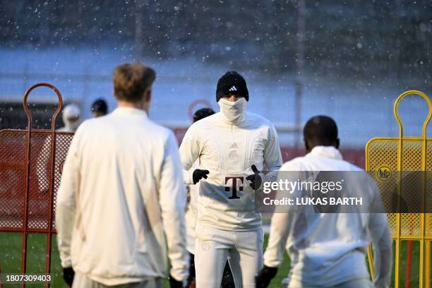 Bayern Munich's English forward Harry Kane attends a training session during snowfall on November 28, 2023 in Munich, southern Germany, on the eve of...