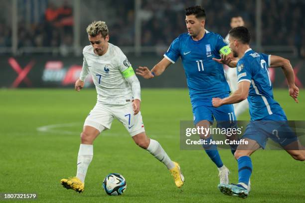 Antoine Griezmann of France, Tasos Bakasetas of Greece in action during the UEFA EURO 2024 European qualifier match between Greece and France at OPAP...