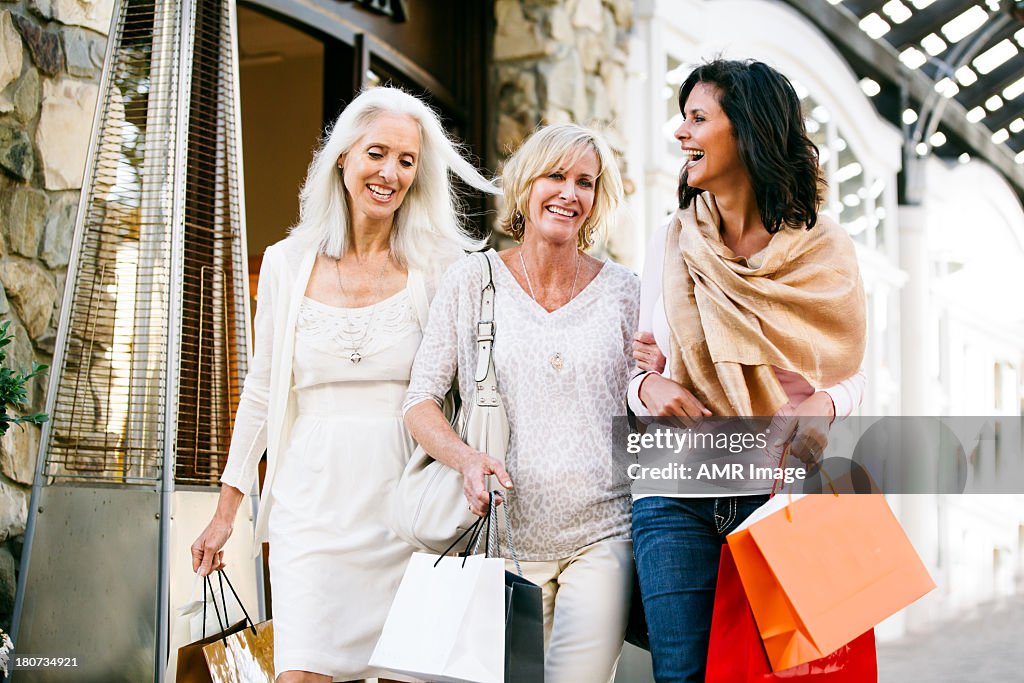 Trio of Beautiful mature women shopping