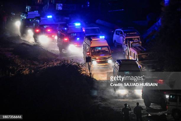 Ambulances carrying rescued workers leave after emergency and rescue teams safely brought out all trapped workers from the collapsed Silkyara tunnel...