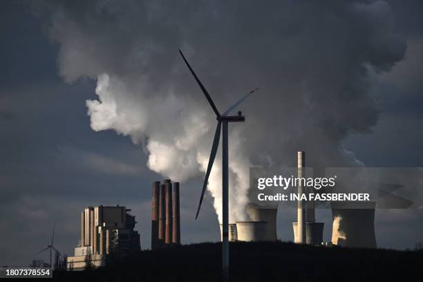 This picture taken on November 28, 2023 shows the lignite-fired power station operated by German energy giant RWE in Neurath, western Germany. The...