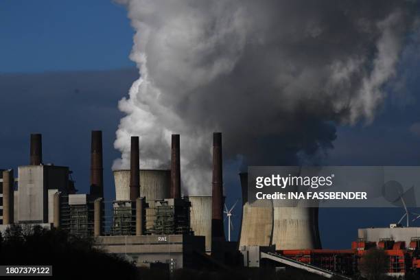 This picture taken on November 28, 2023 shows the lignite-fired power station operated by German energy giant RWE in Neurath, western Germany. The...