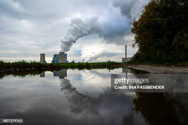 This picture taken on November 28, 2023 shows the lignite-fired power station operated by German energy giant RWE in Neurath, western Germany. The...