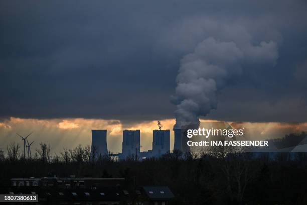 This picture taken on November 28, 2023 shows the lignite-fired power station operated by German energy giant RWE in Neurath, western Germany. The...