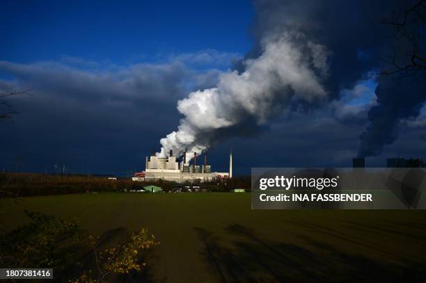 This picture taken on November 28, 2023 shows the lignite-fired power station operated by German energy giant RWE in Neurath, western Germany. The...