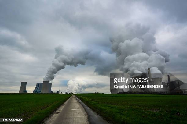 This picture taken on November 28, 2023 shows the lignite-fired power station operated by German energy giant RWE in Neurath, western Germany. The...