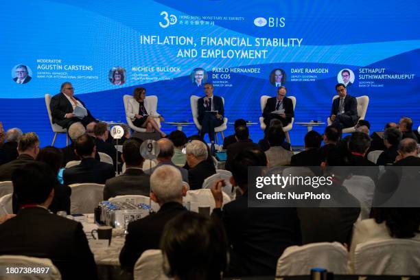 From left to right, General Manager of the Bank for International Settlements, Agustin Carstens, Governor of the Reserve Bank of Australia, Michele...