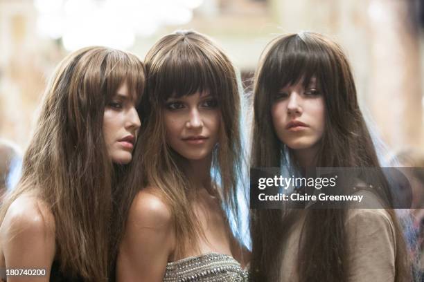 Models pose backstage wearing Frontcover Cosmetics at the Kristian Aadnevik show during London Fashion Week SS14 at The Royal Horseguards on...