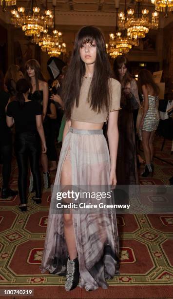 Model poses backstage at the Kristian Aadnevik show during London Fashion Week SS14 at The Royal Horseguards on September 15, 2013 in London, England.