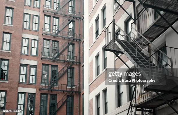 facades of former industrial buildings in the fort point area of boston, usa - fort point channel stock pictures, royalty-free photos & images