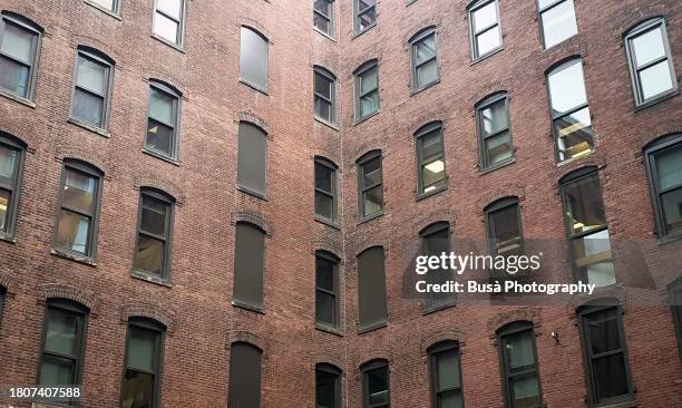 facades of former industrial buildings in the fort point area of boston, usa - fort point channel stock pictures, royalty-free photos & images