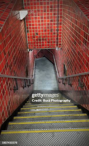 staircase in subway tunnel - american neon signs by day and night stock pictures, royalty-free photos & images