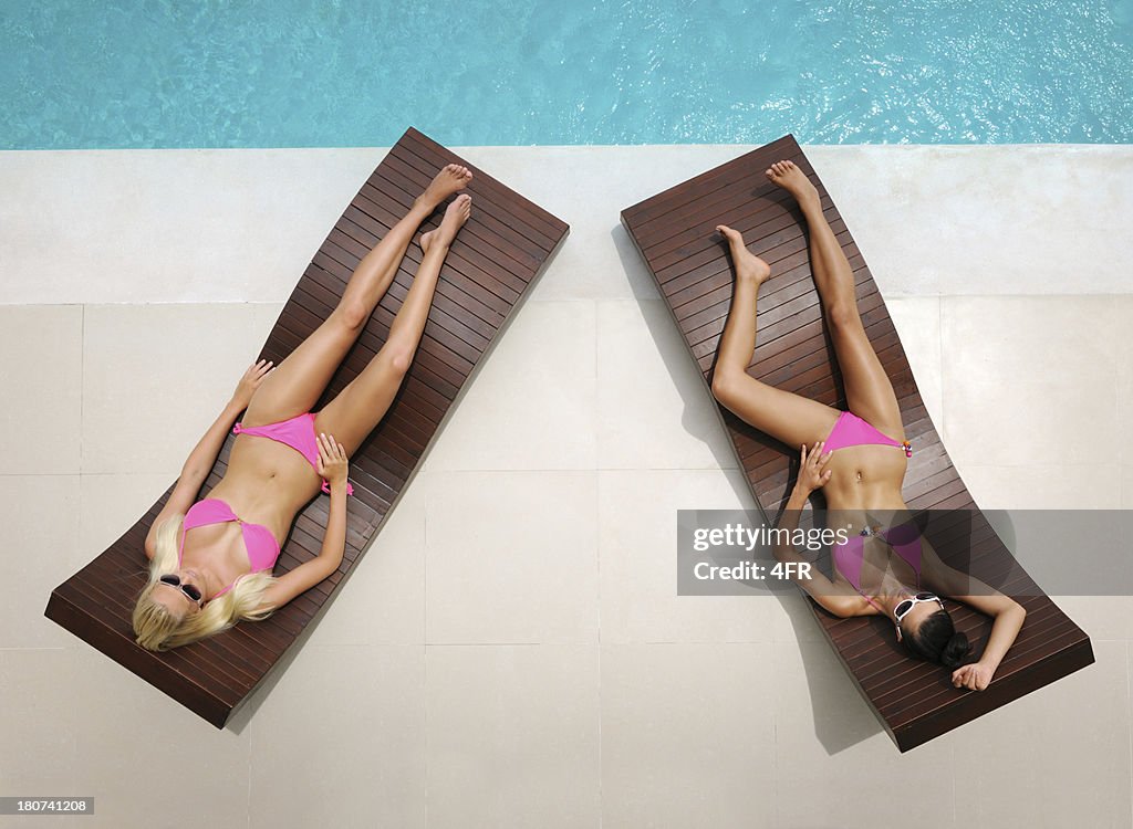 Beautiful women relaxing by the Pool