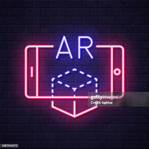 ar augmented reality with smartphone. glowing neon icon on brick wall background - touch screen wall stock illustrations