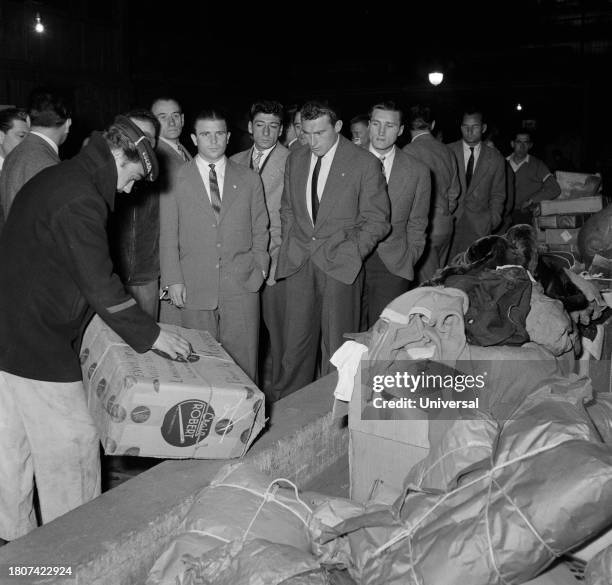 Hungarian soccer player Ferenc Puskas with Hungarian footballers visiting the rescue center for the Hungary, November 12, 1956 in Paris.