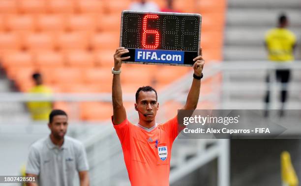 Fourth Official Dahane Beida holds up a extra time board during the FIFA U-17 World Cup Round of 16 match between England and Uzbekistan Eat Jakarta...