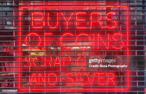 pawn shop neon sign behind metal grate - antique dealer stock pictures, royalty-free photos & images