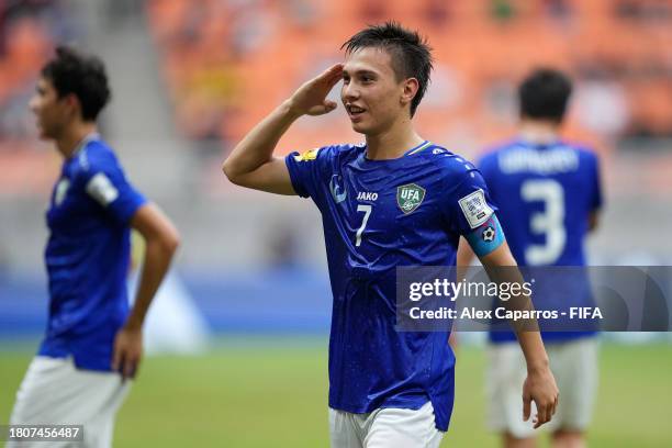 Lazizbek Mirzaev of Uzbekistan celebrates after scoring the team's first goal during the FIFA U-17 World Cup Round of 16 match between England and...