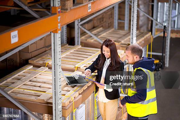 female warehouse manager - satisfaction stock pictures, royalty-free photos & images