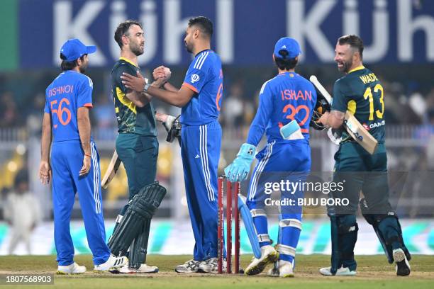 Australia's captain Matthew Wade and his teammate Glenn Maxwell salute Indian Team after winning the third Twenty20 international cricket match...