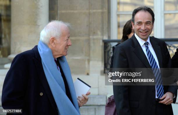 French writer and journalist Jacques Chancel chats with Jean-Francois Cope, head of the "group for the new public television" as they leave the...