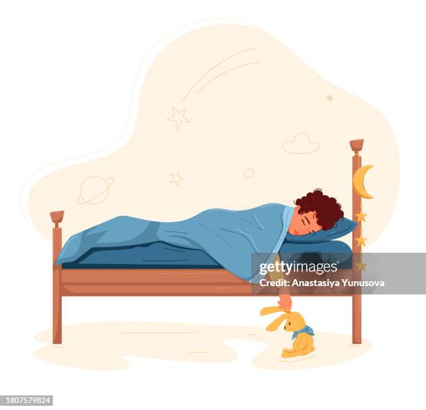 sleeping boy with a toy - toddler bedtime stock illustrations