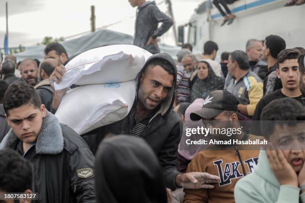 Distributes flour to Palestinian refugees on November 22, 2023 in Khan Yunis, Gaza. On Tuesday night, Israel and Hamas agreed to a four-day pause in...