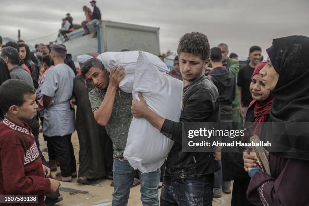 Distributes flour to Palestinian refugees on November 22, 2023 in Khan Yunis, Gaza. On Tuesday night, Israel and Hamas agreed to a four-day pause in...