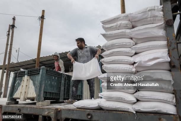 Distributes flour to Palestinian refugees on November 22, 2023 in Khan Yunis, Gaza. On Tuesday night, Israel and Hamas agreed to a four-day pause in...