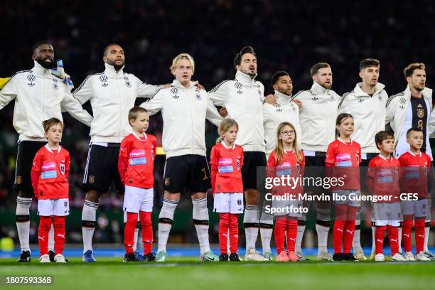 Antonio Ruediger, Jonathan Tah, Julian Brandt, Mats Hummels, Serge Gnabry, Niclas Fuellkrug, Kai Havertz and Leon Goretzka of Germany singing the...