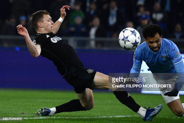 Lazio's Brazilian midfielder Felipe Anderson fights for the ball with Celtic's Canadian defender Alistair Johnston during the UEFA Champions League...
